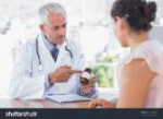 stock-photo-doctor-explaining-the-bottle-of-pills-to-patien[...].jpg