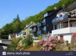 Typical Norwegian wooden houses with small gardens on a ste[...].jpg