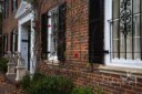 Another typical large old brick Georgetown house with black[...]