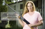 640-01357952em-woman-in-trailer-park-with-shotgun.jpg