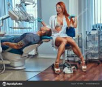 depositphotos181179394-stock-photo-sexy-hot-redhead-dentist[...].jpg