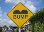 1200px-BelizeSpeedBumpSign.JPG