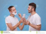 two-happy-young-guys-white-t-shirts-one-guy-shaves-beard-to[...].jpg