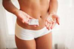 contraception-safe-sex-choosing-a-contraceptive-sexy-girl-with-a-condom-and-pills-in-her-hands11845.png