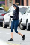 elizabeth-olsen-wears-a-navy-sweatshirt-and-blue-leggings-f[...].jpg