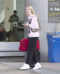 elle-fanning-at-airport-in-toronto-08-05-2019-9.jpg