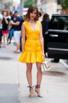 alison-brie-looks-cute-in-a-yellow-dress-while-visiting-bui[...].jpg