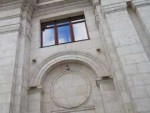 Old building with dramatic sky reflection in the window.jpg