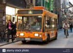 electric-bus-in-florence-italy-with-man-passing-on-a-bicycl[...].jpg