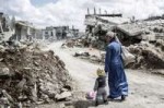 woman-and-child-in-kobani-syria.jpg.size-custom-crop.1086x0.jpg